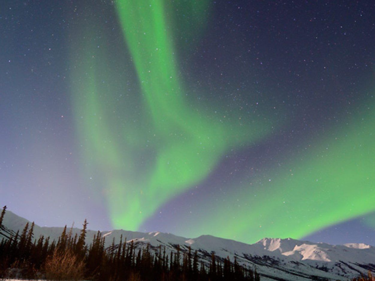 Strange Blue Spiral Illuminates Alaska’s Nighttime Sky