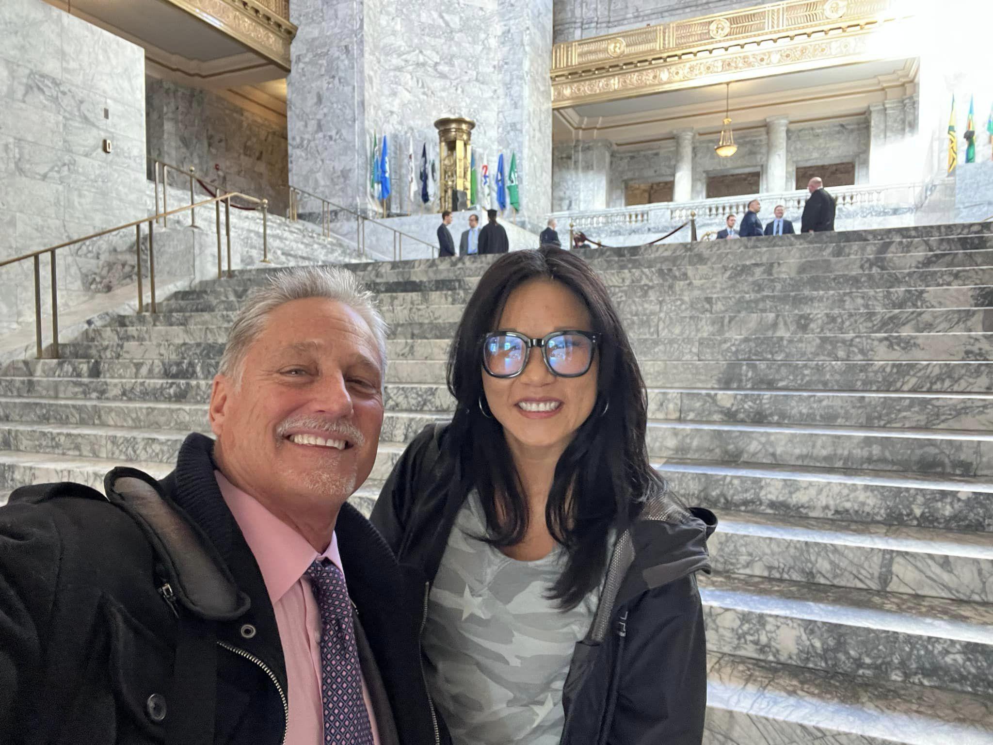 Senator Jeff Wilson and his wife stand in front of steps